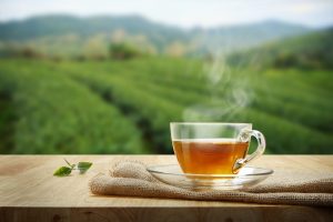 Tea,Cup,With,Green,Tea,Leaf,On,The,Wooden,Table 15 grudnia – Międzynarodowy Dzień Herbaty